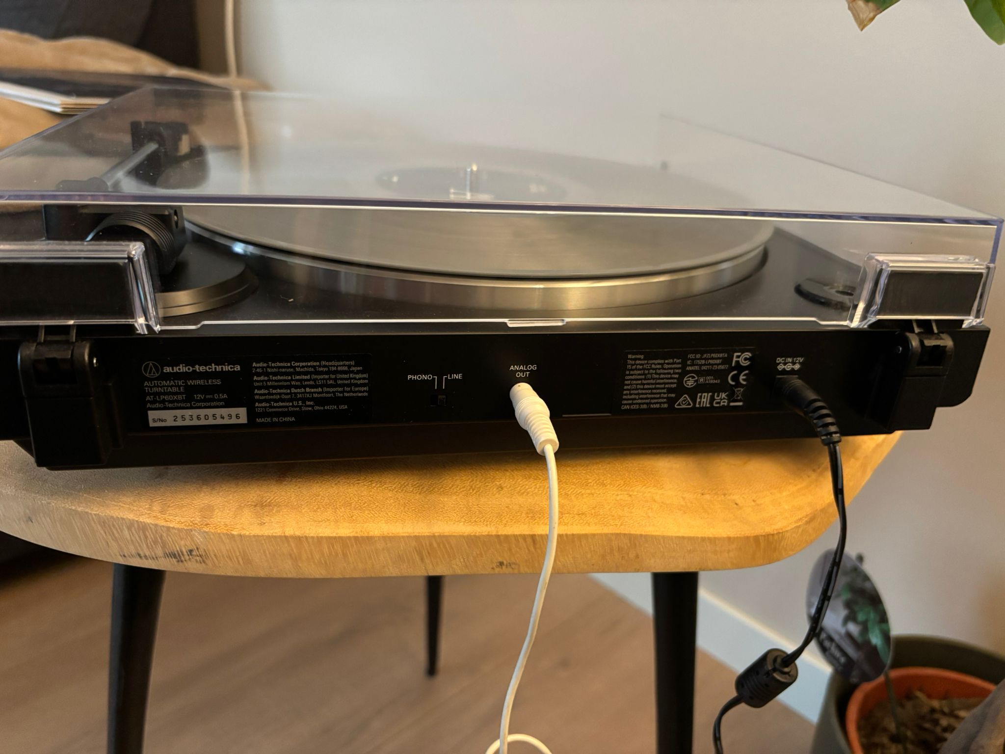 Close-up of a turntable's Analog Out jack with the RCA-to-3.5mm cable plugged in